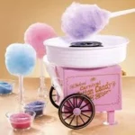 Étiquette du fondant parfumé 'Barbe à papa' à la cire de soja. L'illustration montre une petite machine à barbe à papa rose et des barbes à papa multicolores évoquant la fête foraine.