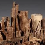 Étiquette du fondant parfumé 'Bois de oud' à la cire de soja. L'illustration est une photo de morceaux de bois d'agar (oud), évoquant un parfum boisé, oriental et luxueux.
