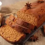 Étiquette du fondant parfumé 'Pain d'épices' à la cire de soja. L'illustration est une photo d'un pain d'épices maison tranché, évoquant un parfum gourmand, épicé et chaleureux de Noël